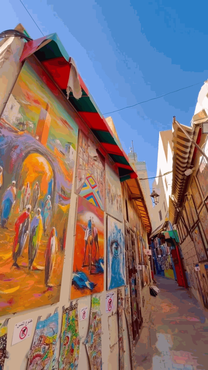 Vibrant narrow streets of the Fes medina with colorful shops and traditional architecture